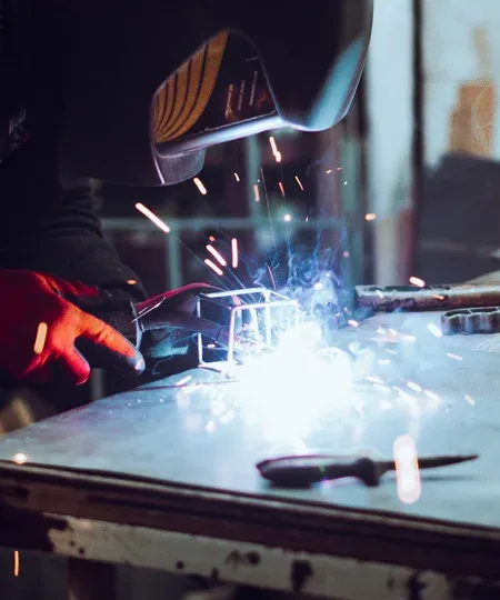 Welder working with protective mask