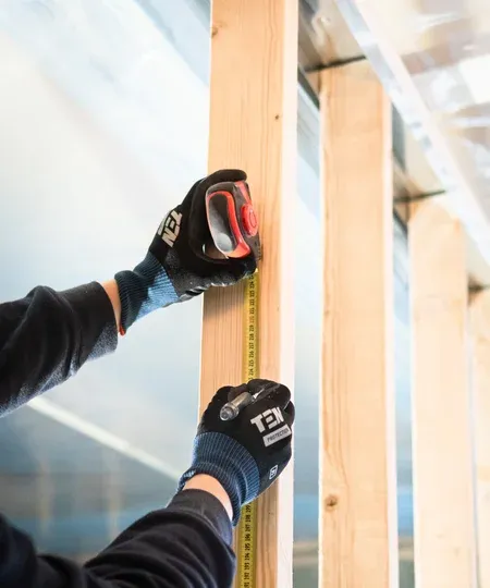 Worker using angle grinder